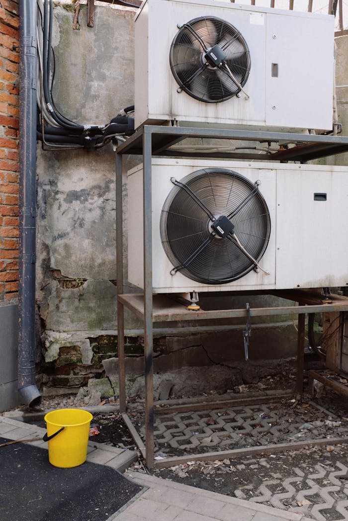 Outdoor installation of industrial cooling units in an urban setting.